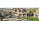 Charming two-story home with manicured landscaping, a driveway, and a welcoming front entrance at 7628 W Donald Dr, Peoria, AZ 85383