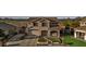 Beautiful home with a spacious driveway and well-manicured front yard landscaping at 7628 W Donald Dr, Peoria, AZ 85383