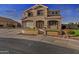 Inviting two-story home with landscaped front yard and charming architectural details and covered porch entrance at 7628 W Donald Dr, Peoria, AZ 85383