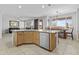 Open-concept kitchen with island, stainless steel appliances, and adjacent dining area for gatherings at 7628 W Donald Dr, Peoria, AZ 85383
