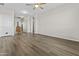 Spacious living room with wood floors, neutral paint and trim and an open floor plan at 7628 W Donald Dr, Peoria, AZ 85383