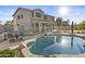 Inviting backyard pool with an outdoor dining and living space, perfect for entertaining at 7628 W Donald Dr, Peoria, AZ 85383