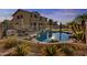 Relaxing backyard pool with mature tropical landscaping, and a patio area perfect for outdoor entertaining at 7628 W Donald Dr, Peoria, AZ 85383