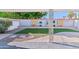 Charming backyard with artificial grass, decorative rock, and modern design elements, perfect for outdoor enjoyment at 7732 E Coolidge St, Scottsdale, AZ 85251
