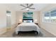 Cozy bedroom featuring a plush bed, a ceiling fan, and natural light from the windows, creating a relaxing retreat at 7732 E Coolidge St, Scottsdale, AZ 85251