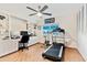 Versatile bonus room equipped as an office and gym space with ample storage at 7732 E Coolidge St, Scottsdale, AZ 85251
