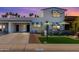 Inviting home exterior showcasing a neatly paved driveway and well-maintained lawn at 7732 E Coolidge St, Scottsdale, AZ 85251