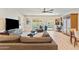 Comfortable living room featuring a cozy sofa, modern TV, and a view of the outdoors at 7732 E Coolidge St, Scottsdale, AZ 85251