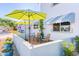 Relaxing patio area with chairs, table, and umbrellas, perfect for outdoor enjoyment at 7732 E Coolidge St, Scottsdale, AZ 85251