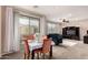 Dining area with a table, chairs, and sliding glass doors leading to a balcony at 8105 W Groom Creek Rd, Phoenix, AZ 85043