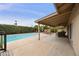 A relaxing backyard featuring a pool, patio, covered space, and lush, green landscaping at 8317 E Via De La Escuela --, Scottsdale, AZ 85258