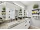 Modern bathroom with double sinks, granite countertops, and decorative plants for a spa-like ambiance at 8317 E Via De La Escuela --, Scottsdale, AZ 85258