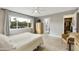 Bright bedroom featuring a ceiling fan, closet, and a view through a large window at 8317 E Via De La Escuela --, Scottsdale, AZ 85258