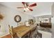 Charming dining area adjacent to the living room, featuring a rustic wooden table and comfortable seating at 8317 E Via De La Escuela --, Scottsdale, AZ 85258