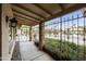 Cozy front porch with decorative ironwork and well-maintained landscaping at 8317 E Via De La Escuela --, Scottsdale, AZ 85258