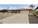 Charming single-story home features a neutral exterior, well-maintained landscaping, and an attached two-car garage at 8317 E Via De La Escuela --, Scottsdale, AZ 85258