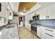 Stylish kitchen featuring stainless steel appliances, granite countertops, and modern white cabinetry at 8317 E Via De La Escuela --, Scottsdale, AZ 85258