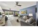 Inviting living room featuring comfortable seating, a ceiling fan, and sliding glass doors to the pool area at 8317 E Via De La Escuela --, Scottsdale, AZ 85258