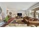 Spacious living room featuring a plush sofa, stylish rug, and sliding glass doors to the backyard at 8317 E Via De La Escuela --, Scottsdale, AZ 85258