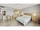 Cozy bedroom with a wicker chair, ceiling fan, and wooden furniture offering a relaxing retreat at 8317 E Via De La Escuela --, Scottsdale, AZ 85258
