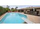 Backyard swimming pool surrounded by patio space, lounge chairs, and a covered deck area at 8317 E Via De La Escuela --, Scottsdale, AZ 85258