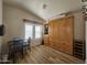 Cozy bedroom with wooden floors and a murphy bed for extra space at 8700 E University Dr # 953, Mesa, AZ 85207