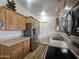 Spacious kitchen with stainless steel appliances, abundant wood cabinetry, and ample counter space for culinary activities at 8700 E University Dr # 953, Mesa, AZ 85207