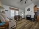 Relaxing living room features comfortable seating, and wood-look flooring, creating a welcoming space in the home at 8700 E University Dr # 953, Mesa, AZ 85207