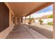 A covered back patio overlooking a xeriscaped backyard with cacti and a block wall at 9136 W Sequoia Dr, Peoria, AZ 85382