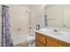 Well-lit bathroom features a bathtub-shower combo and a wood vanity with a sink at 914 N Cherry --, Mesa, AZ 85201