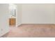 Open bedroom leading to bathroom, featuring plush carpeting and neutral tones for a comfortable living space at 914 N Cherry --, Mesa, AZ 85201