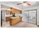 Kitchen with a sliding glass door offers a bright and airy feel, complemented by wood cabinets at 914 N Cherry --, Mesa, AZ 85201
