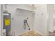 Practical laundry area with water heater, washer hookups, and open shelving at 914 N Cherry --, Mesa, AZ 85201
