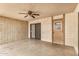 Covered patio featuring textured walls, a brick accent wall, and a ceiling fan at 914 N Cherry --, Mesa, AZ 85201