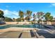 A community pool surrounded by trees and lounge chairs is a refreshing place to unwind at 914 N Cherry --, Mesa, AZ 85201