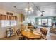 Inviting living room with wooden table, classic white cabinets, open to the kitchen and living area with lots of light at 9427 E University Dr # 36, Mesa, AZ 85207