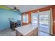 View from kitchen island to dining room and backyard access at 10318 W Luke Ave, Glendale, AZ 85307