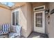 Cozy front porch featuring patio chairs and a decorative welcome mat by the front door at 10318 W Luke Ave, Glendale, AZ 85307