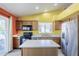 Spacious kitchen with stainless steel appliances, a kitchen island, and tile flooring at 10318 W Luke Ave, Glendale, AZ 85307