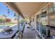 Inviting covered patio with a grill, outdoor furniture, and view of the pool at 10318 W Luke Ave, Glendale, AZ 85307