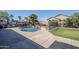 Backyard pool with rock waterfall feature, mural on the fence and desert landscaping at 10318 W Luke Ave, Glendale, AZ 85307