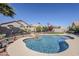 Sparkling backyard pool with rock features and desert landscaping surrounded by secure fencing at 10318 W Luke Ave, Glendale, AZ 85307