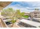 Aerial view from the balcony showing parking, neighboring buildings and landscaping at 14950 W Mountain View Blvd # 5312, Surprise, AZ 85374