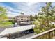 Aerial view of the apartment complex featuring ample parking and tree-lined streets on a clear, sunny day at 14950 W Mountain View Blvd # 5312, Surprise, AZ 85374