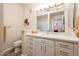 Clean bathroom with white cabinetry, neutral countertops, and decorative elements that give it a modern style at 14950 W Mountain View Blvd # 5312, Surprise, AZ 85374