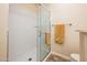 Bathroom featuring a glass shower stall with tiled walls and modern fixtures and neutral walls at 14950 W Mountain View Blvd # 5312, Surprise, AZ 85374