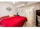 Bedroom featuring a neutral color scheme, tile flooring, and stylish accents that enhance its overall aesthetic at 14950 W Mountain View Blvd # 5312, Surprise, AZ 85374