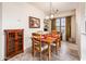 Dining area with built-in shelving and large window provides ample space for entertaining at 14950 W Mountain View Blvd # 5312, Surprise, AZ 85374