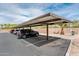 Convenient covered parking area with multiple parked cars, providing protection from the elements and sunshine at 14950 W Mountain View Blvd # 5312, Surprise, AZ 85374