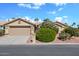 Charming single-story home with a well-maintained lawn, desert landscaping, and a two-car garage at 15546 W Whitton Ave, Goodyear, AZ 85395